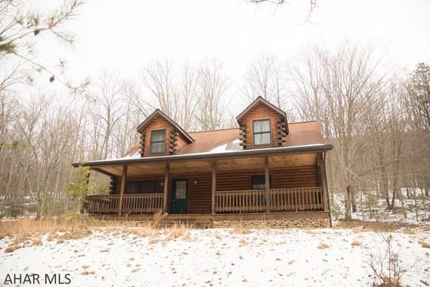 Are you looking for a dream cabin or a forever home in the woods?  Look no further.  This log cabin offers beautiful views,10 acres of  hunting ground and a private pond.  3 bedrooms, 1 bath and a large living area with a stone fireplace.  An unfinished basement to make more living space if you wish.  A private drive up to your paradise is waiting for you! Conveniently located only 35 minutes from Bedford and 15 minutes to I68.   A must see!