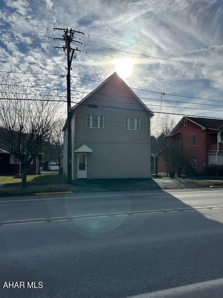 Great opportunity for investors or handyman ready to update a large single family home or make into multi unit residential spaces. Two bedrooms on the main floor with one full bath and one half bath. 4 bedrooms upstairs with one full bath. Two kitchen spaces. Two car detached garage. Tons of potential!