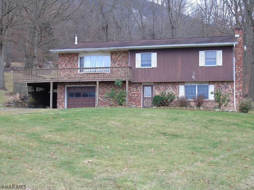 Looking for a quiet, country setting to establish your home?  This 3 bedroom, 2.5 bath home sits on approximately 3.5 acres of land in the Loop Area of Hollidaysburg.  This home has two wood stoves and a fireplace that you could enjoy all while taking in beautiful mountain landscapes and watching wildlife in your yard.  This home offers a finished basement, an integral garage, an eat in kitchen, and much more.  Call today to schedule your tour!  Taxes will need verified by buyers agent.