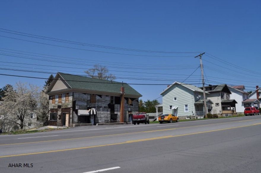 REMODELING STARTED. THIS IS A CONTRACTORS DREAM PROJECT. THIS IS A WORK IN PROGRESS. A LOT OF THE WORK HAS BEEN COMPLETED. A SET OF BUILDING PLANS ARE AVAILABLE.  THE FIRST FLOOR IS STRIPED OUT AND READY TO BE MADE INTO A COMMERCIAL STORE. THE SECOND FLOOR IS FRAMED OUT FOR TWO 2 BEDROOM APARTMENTS THE ROOF IS NEW, THE ELECTRICAL IS UP TO DATE. THERE IS A FULL BASEMENT GOOD CEILING HEIGHTS.
