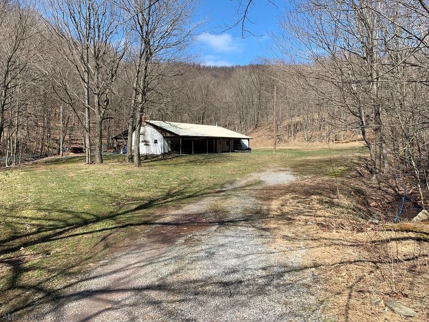 Getaway in the Mountains resting on 7 +/- Acres. With some work this property could make a great place to kickback and relax and enjoy the outdoors with Family and Friends. Located not far from PA State Game Lands, New Baltimore Sportsman's Club, Trout Streams, Raystown Branch Juniata River, and Indian Lake. Being sold "AS-IS" and interior pictures are available upon request.