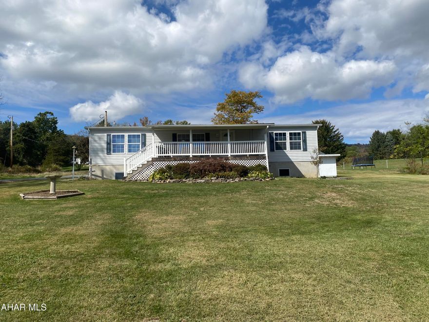 Beautifully well maintained, move in ready, 3 bedroom 2 bath ranch home in Northern Bedford School District. Outside you'll enjoy one of the best views the Cove has to offer while relaxing on the covered front porch. Plenty of space to garden and enjoy a wonderfully large yard. This property has an over-sized 2 car detached garage along with a large shed for lawn equipment and storage. Inside you'll notice how well the home has been taken care of and maintained. All appliances are included! Plenty of room to move around with convenient single level living. The basement has easy access and plenty of space for storage or additional rooms. Handicap ramp accessibility. Conveniently located close to State Game Lands.