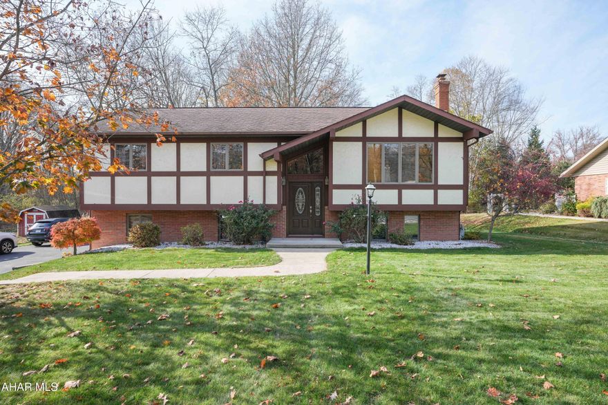 Hollidaysburg Schools.  Very well maintained Split-Entry on a level lot.  Updated kitchen which includes all appliances, backsplash, Quartz C-tops, Garden Window and doors to a 2 tier deck, Updated flooring and baths. Downstairs you'll find a spacious Family Room, half bath and laundry. Lots of space in the true 2 car garage for storage and toys.  Extras include a whole house fan, gas or coal heat,, washer, dryer and a built-in safe!