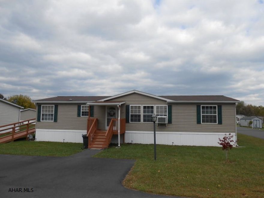 Great location in Duncansville on a large lot (125 x 120) This Doublewide (year 2000) has 3 Br, 2BA with a skylight. Living Room with built in entertainment area and eat-in kitchen. The luxurious Master BR has a walk-in closet,spa tub and a separate shower, linen cupboard, and double sink. This home is spotless and move in ready! New hot water tank just installed in February.