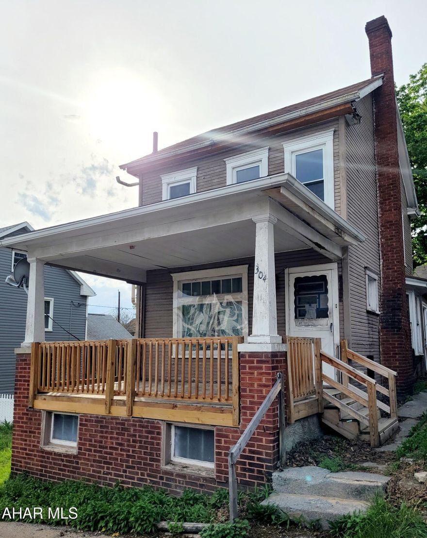 Attention investors! This project already has been started and is looking for your vision! This house features 2 bedrooms on the 2nd floor, and the potential for a bonus space on the 3rd floor. The full bath on the 2nd floor already has some beautiful tile work done. The first floor features a good size living room, a dining room with a bay window, a decent sized kitchen, and a small mud room that could be perfect for 1st floor laundry. Out back is a garage with two levels! The yard is almost completely fenced in. The front porch has plenty of space for relaxing. This one has a ton of potential - schedule your showing today to imagine how you could make it a show stopper!