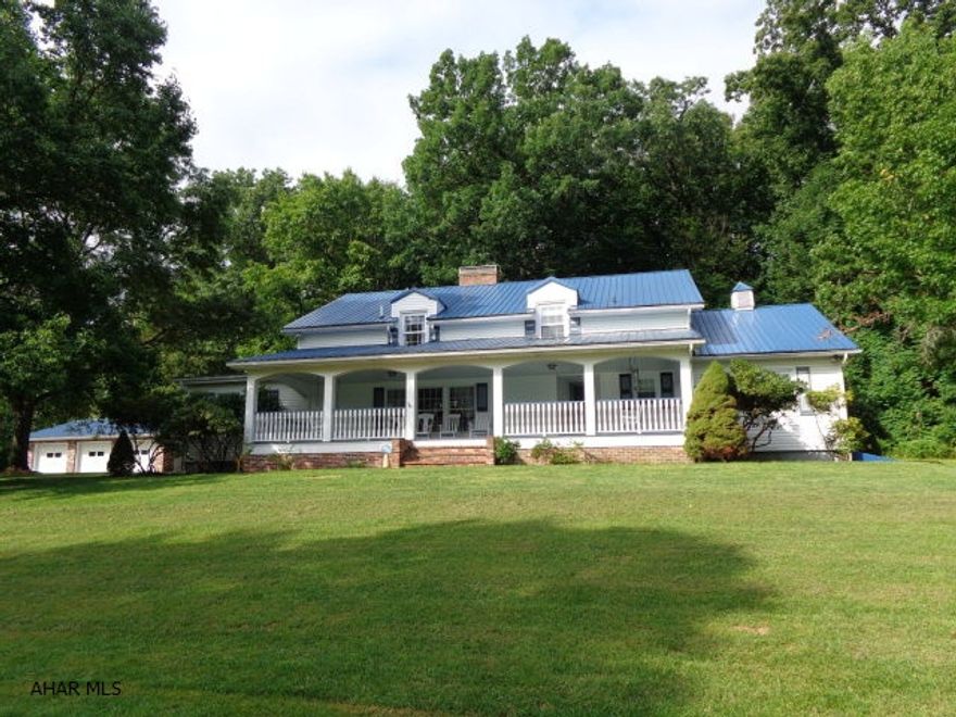 MOTIVATED SELLER! Exceptional property with 4.89 acres, over-sized 3 car brick garage, 3 fireplaces. Enormous dining room with hardwood floor. Unique bar with seating for 8. 4-5 bedrooms. Incredible Master Suite includes a sitting area + dressing room. Master Bath has a 6-jet jacuzzi. Southern style front porch has 2 porch swings + 4 rocking chairs. Newer metal roof, closets galore, brick patio with a view. Large basement with fireplace is ready to finish. Listing price is significantly lower than a recent appraisal price.