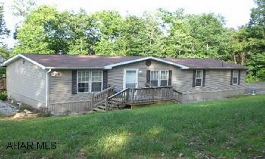 Newer doublwide home resting on 1.446 acres.  This property offers four bedrooms, a living room, family room, kitchen and two baths.  Nice country setting but convenient to town.  (From Bedford take Route 326 at the Narrow's Bridge.  Follow Route 326 straight for a few miles to a right onto Black Bear Lane.  Follow Black Bear to the property on the left.)