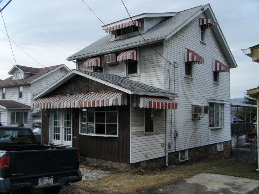 New carpet and padding. Nice sized living room with picture window. Large rear deck with roof. Garage roof is in poor condition. Property is zoned Highway Business.