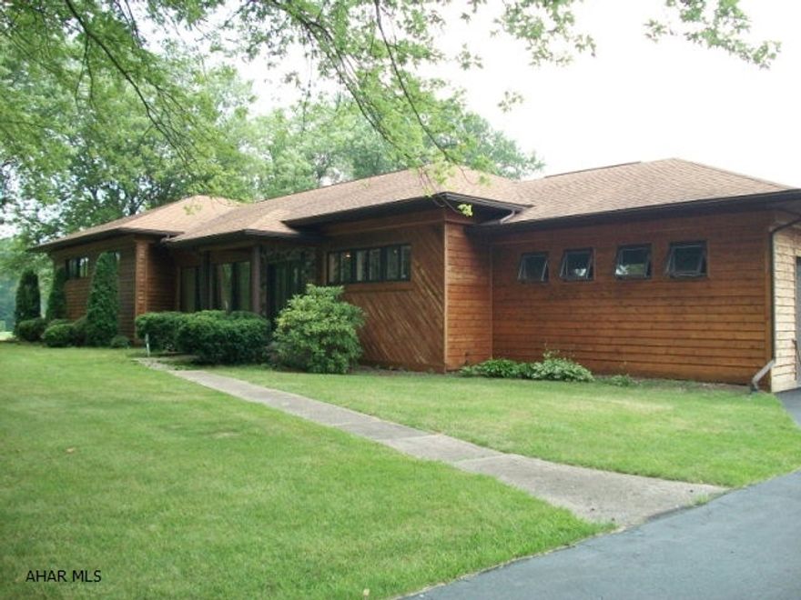 Fabulous cedar-sided home on 1.5 ac!  Very large, level backyard.  Stone fireplace.  Custom kitchen.  Large, open dining room-living room area.  Main floor laundry.  Heated workshop/garage.  Lots of storage.  Cedar closet in basement. Heat is zoned for maximum efficiency.  2nd level is just a few steps up from main level.  Alarm system.  Paved driveway.  Convenient to I99.  Great home - move in ready!