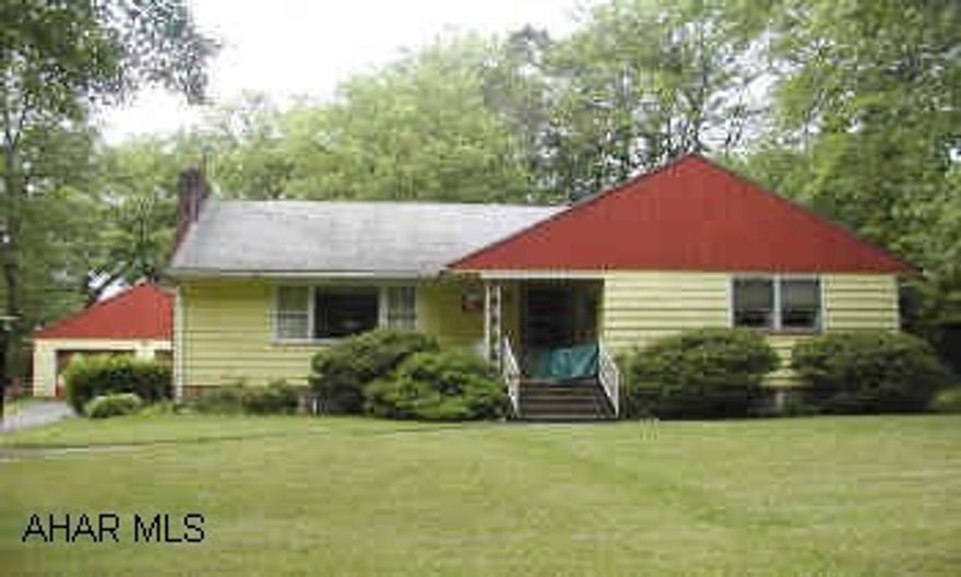 2 Bedroom ranch home with 2 car garage. Level 3/4 acre lot.  Fireplace, appliances.  New furnace. 2 Bedroom ranch home with separate 2 car garage.  Hardwood floors, fireplace appliances. Out of town with 3/4 acre lot, municipal water and sewer.