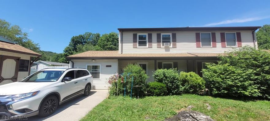 Great potential in this four bedroom one bath  home in the Klock Development.  This half a double home has had major improvements in 2019 including: finishing of first floor bedroom, updated breaker panel, enclosed back porch and new roof, to name a few. With some updates this house will be your new home. There is off street parking with shed and fenced in back and side yard. Call today for your tour.