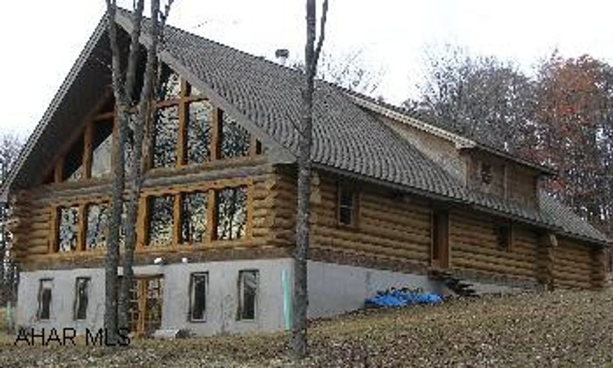 Beautiful Log Home on 55+/- private acres, plus a 30x60 Block building with electric, well and septic.  Log Home is 85% finished.  30x60 Block Building needs new roof. Beautiful Log Home on 55+/- private acres, plus a 30x60 Block building with electric, well and septic.  Log Home is 85% finished.  30x60 Block Building needs new roof.