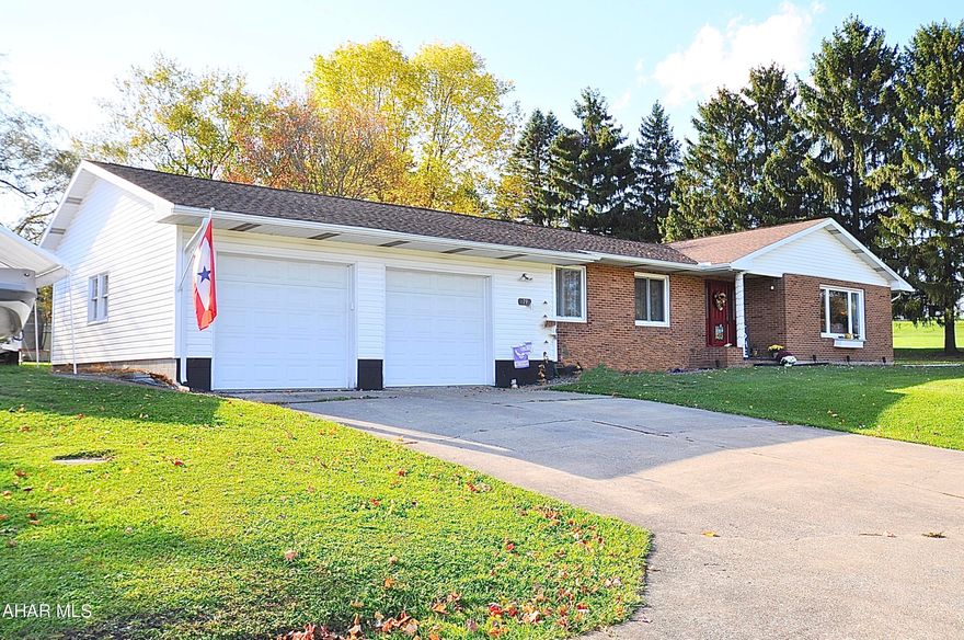 Wow! This beautiful sprawling ranch style home has been refinished and is located on a large, wooded lot in Woodward Township, Clearfield County, just outside of Houtzdale Borough. On the main floor you will find sleek vinyl plank flooring, a large welcoming country style kitchen with lots of counter space and gleaming stainless steel appliances, two large living rooms each with a toasty wood burning fireplace, a private owners suite with a sunlight filled full bathroom, 2 additional bedrooms sharing another full bathroom, a private office (or 4th main level bedroom), and laundry room with 1/2 bathroom. The lower level contains a large theatre room, 2 additional bedrooms, and another full bathroom; this lower level has been beautifully finished with quality materials and contains lots of natural lighting. A large 2 car attached garage with massive driveway provides ample space to park your boat or recreational vehicle. You will enjoy the covered rear patio and level wooded rear yard. See this property today and make it yours before someone else does!