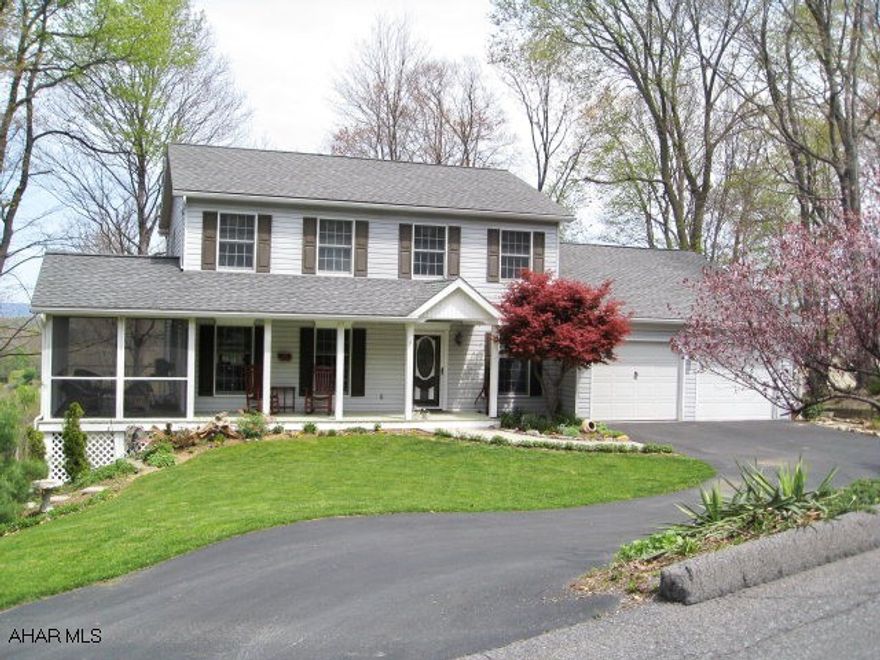 Impressive 2-story vinyl-sided house w/shutters located in ideal residential neighborhood. Private setting yet close to town. 3BR/2 1/2BA, custom kitchen with breakfast nook and bay window. Large family room with lots of windows opens to deck overlooking trees and the town of Bedford. Formal dining room and living room. Side screened porch, front porch and rear deck.