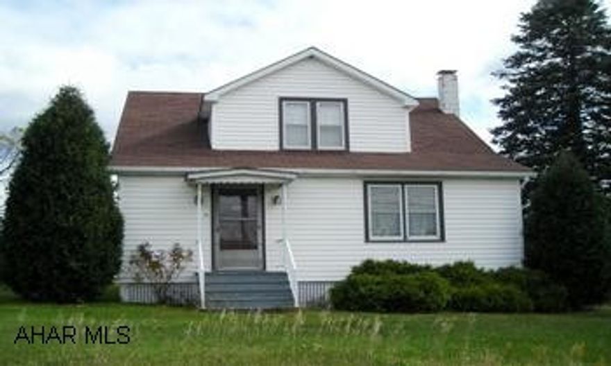 Off Rt 31 Much value here in this 3 bedroom, 1.5 bath bungalow on almost 10 acres! This home needs some work but could be completely charming! Much natural woodwork and a beautiful staircase, wood floors under carpeting, arched doorways, half bath on 1st floor, large eat-in kitchen PLUS a dining room!  Two furnaces, walk-out basement, detached 2 car garage, wonderful views! All this for $ 170,000, call Tina today at 814-242-2047.