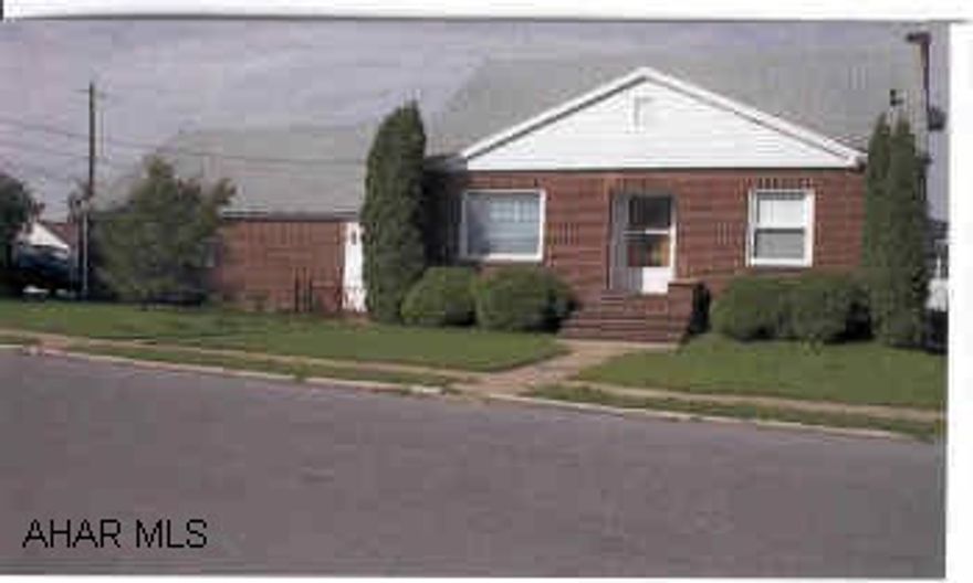 3 Bedroom Brick home on corner lot in nice neighorhood.  One full bath, 2-1/2 baths.  Central Air - nice yard.