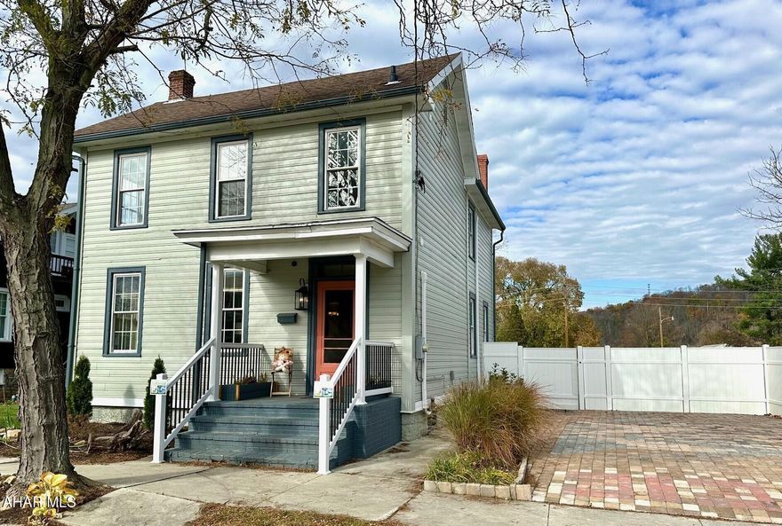 A charming nicely renovated 3 bedroom 2 bath home has everything you need!! The front porch invites you into the open foyer of the home.  A spacious living room and dining room has the original walnut built-in arch way and shelving which adds to the warm painted walls. New double pane windows and AC mini splits and a single french backdoor off kitchen. The galley kitchen has all LG new stainless steel appliances and cabinetry  and recess lighting. Eye catching  handmade solid wood countertops. The 2nd floor features a stackable washer/dryer and pine closet. The master bath large shower and modern glass door.  Bright spacious  bedrooms and beautiful wood flooring. The spacious 2nd bath offers a tub and storage.  Back porch leads to the unique patio made of brick pavers. The white vinyl privacy fence adds to landscaping with the spacious backyard for all your enjoyment.  The off street parking is a bonus showing off the 2 car parking space with its unique brick pavers giving the outside that wow !!  Home Sweet Home is this home!!  Centrally located and walking distance to town and schools!!