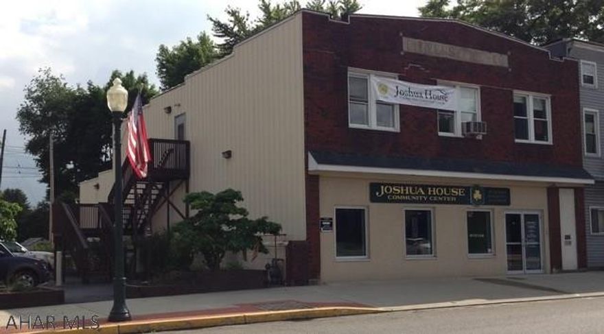 Large building with open 1st floor and offices on 2nd floor