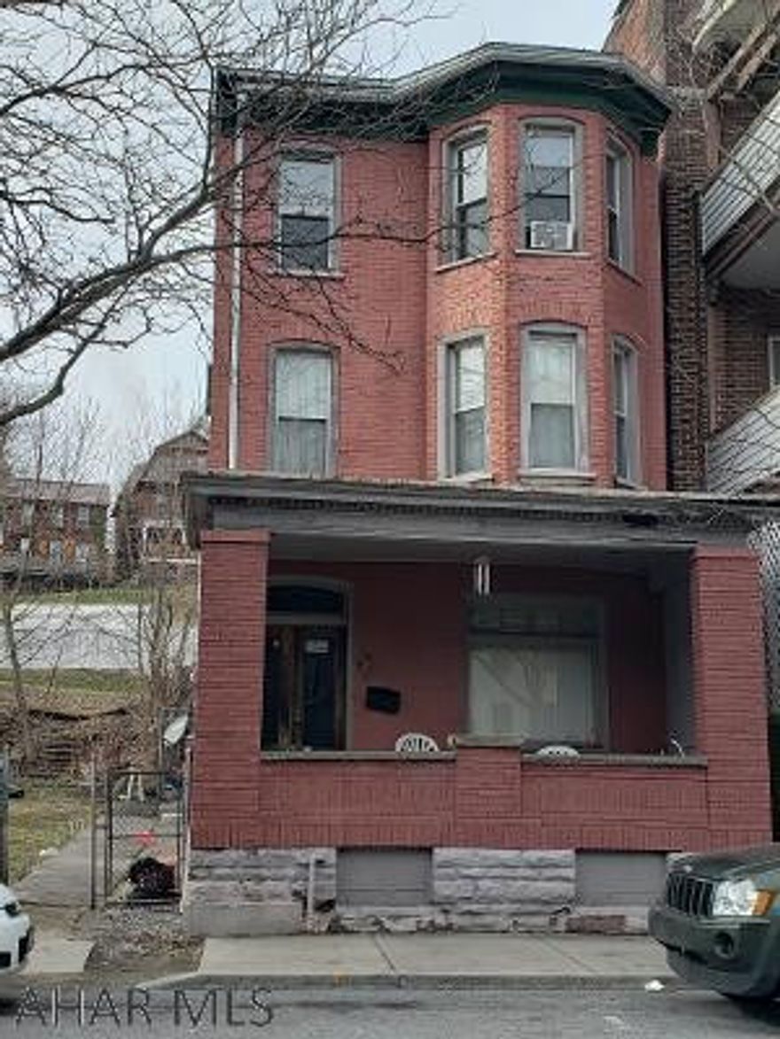 Incredible brick home sold with vacant lot next door!  This house is a must see with 3 stories and tons of charm.  Currently tenant occupied, and could be turned into a duplex.  Don't miss it!  Tax ID: 01.03-08..-130 & 01.03-08..-129