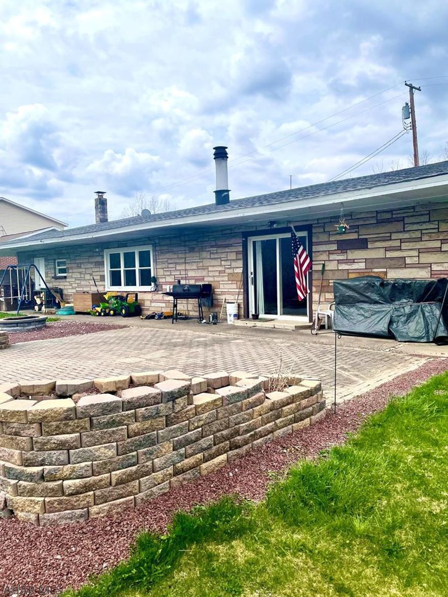 If you are looking for 1 story, open floor plan, attached garage in a private location - you won't want to miss out on this! This home features a large entryway with coat closet, HUGE kitchen with island open to a large dining area with pantry - perfect for any family. The laundry is conveniently located in kitchen and off the kitchen is the large attached garage that could fit 2 cars pulling through and plenty of storage. 3 bedrooms, all including large double closet space & guest bathroom with ceramic tile. The spacious living room has a newly installed pellet stove and sliding door access to the large patio with raised tiered gardens recently added and a built-in firepit, ideal for entertaining guests! The master bedroom has an attached master 3/4 bathroom. Schedule your showing today!