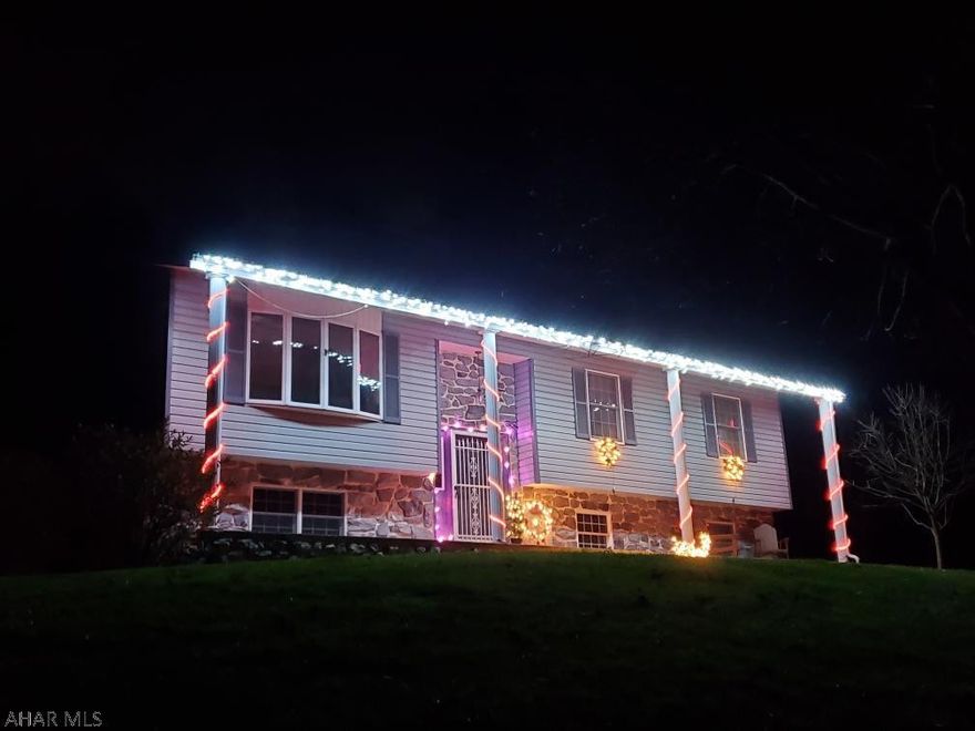 MUST SEE! Well maintained bi-level in Hartslog Valley. This home features many custom moldings and exceptional craftsmanship. The finished lower level is spacious and the space lends itself to only one's imagination. Game rooms, media room, office, extra bedroom all come to mind. The lower level features a newly installed 3/4 bath. But there is more to this property than the house. The outdoor living space features multiple level decking with a covered cooking area, a beautiful covered eating area, open seating area. Step from the deck into an encased above ground pool. The lawn is nicely landscaped with something in bloom year-round and a small orchard. The parcel sits on more than 5 acres with trails bisecting the property for those evening walks. Don't miss seeing this one.