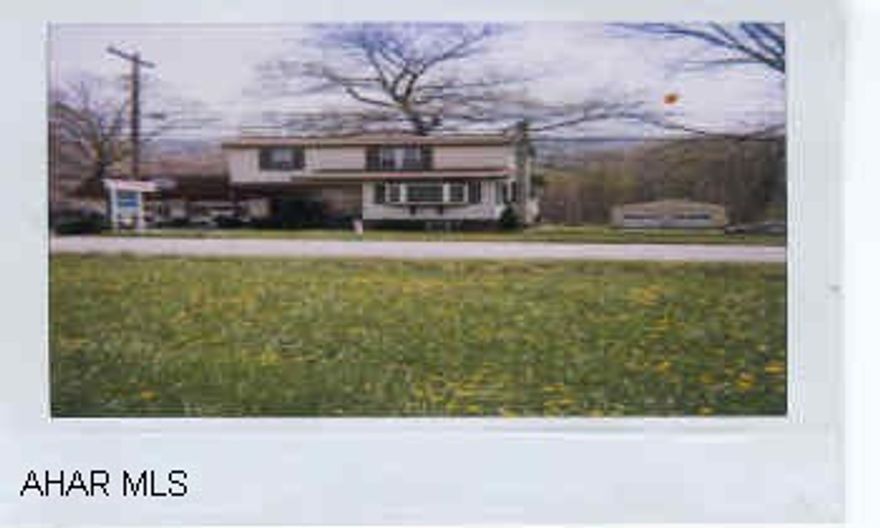 2 story vinyl siding, new thermo windows, Roof 5-7 yr., 150x120 lot, above ground pool. The beauty shop in the back room could be set up as a bedroom.  Tanning bed room in basement.2 story vinyl siding, new thermo windows, roof 5-7 yr, 150 x 120 lot above ground pool.  Extra lot 150x120 in rear.