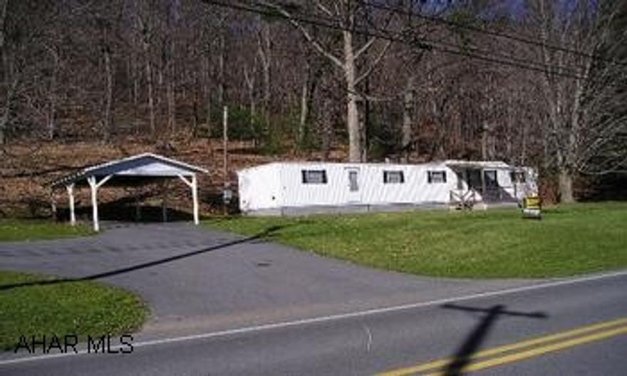 A very well maintained 1967 single-wide Fleetwood Mobile Home with front porch, detached carport, outbuildings - all on 2 acres.  Nice views.  Close to the Bedford Springs Hotel and Golf Course. Located 4 miles +/- South on "Old" Route 220 on the right side but (Due to Bedford Springs detour, take 220 Bypass South to "Business 220"/220 Bypass intersection; make a left onto Business 220 and travel North 0.7 mile - sits on left.  Great starter home.  Very well maintained 1967 single-wide (12X60) Fleetwood mobile home with front porch, detached carport, paved driveway, outbuildings, and cave building - all on 2 acres.  Has ample closet and cabinet space.  Great views.  Close to the Bedford Springs Hotel and Golf Course.