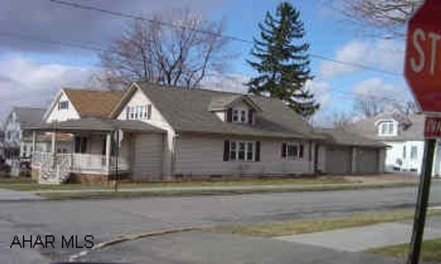 1 1/2 story, 3br, 2 bath home with 2 car  attached garage.  New siding, roof, porch, interior updated. carpeting 1 yr, most windows replaced, oak trim and woodwork surrounding fireplace, bookshelves.