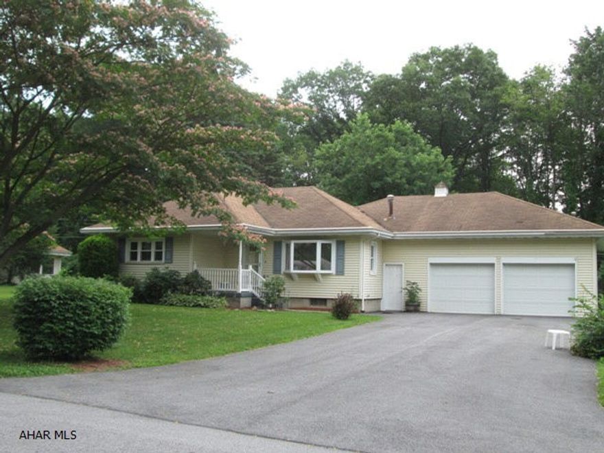 One story in Hollidaysburg. Well built house with private wooded setting. Updated kitchen, finished lower level and private rear patio. Large heated garage with lots of walkup storage area. Updates include vinyl siding, gas hot water heat, newer windows and C/A. Needs some TLC.