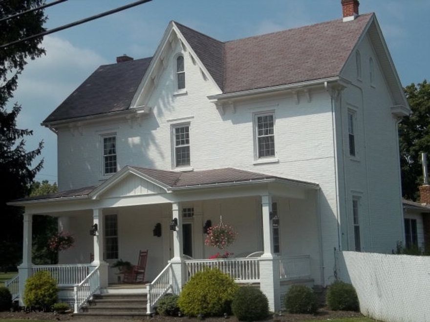 Classic Colonial Revival home with all the charm of a by-gone era.  New kitchen with ceramic tile and stainless appliances, laundry/mudroom (with ceramic tile, super large rooms with high ceilings, new windows, brand new furnace, freshly painted exterior, with 4 brick outbuildings with newer metal roofs, 3-6 bedrooms, 2.5 baths, new kitchen with stainless appliances and high definition laminate counters.  Gardeners: check out the potting shed - a place to store your gardening tools and re pot those perennials.  A special shed for lawn equipment and a 2 car garage. A fenced in flat acre for  kids & pets.   Want to grow your own mushrooms? There's a mushroom house for you!  Great road exposure for professional use.& easy access to Bedford , Altoona and Morrison Cove Area.  Realtor Owned