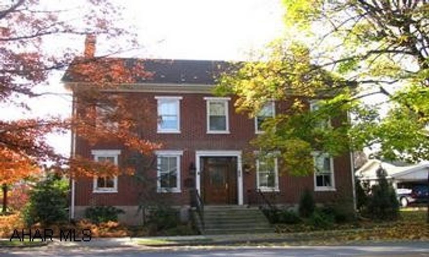 Spacious 5 BR, 2.5 BA brick Georgian. Lg inviting rooms, high ceilings, custom wall coverings & drapes, hardwood floors, cherry cabinets. New windows, furnace & roof. Immaculately maintained 2 1/2 story brick Georgian. Custom mahogany and lead glass entry. Custom cherry cabinetry, marble faced gas fire places, hardwood and tile flooring. Custom wall coverings and drapes. Owner designed spa bath on main floor with relaxation in mind. Custom, custom, custom. Seller do not warranty appliances.