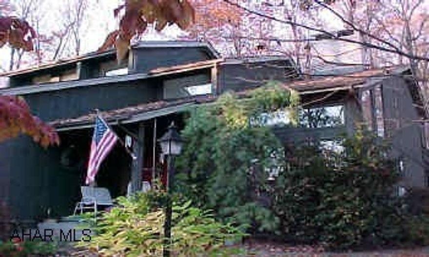 STUNNING HOME WITH SUPERIOR CRAFTSMANSHIP !    2 large window seats in bedrooms with cedar storage . Wonderful  eat-in kitchen which opens to family room. Double sided fireplace in living room & dining room plus addtional fireplace in family room. Custom built home with stunning entrance. Roof 3yrs old, 2 tiered rear patio, great for entertaining.  Gorgeous curved oak staircase in foyer with balcony. 4 zoned HW heat, radon system in place. Cast iron Burnham Baseboard runs for heat. 300+ amp service.Lots of upgrades,superior craftsmanship.  Beautifully landscaped. Terrific master bedroom suite and bath w/private deck.