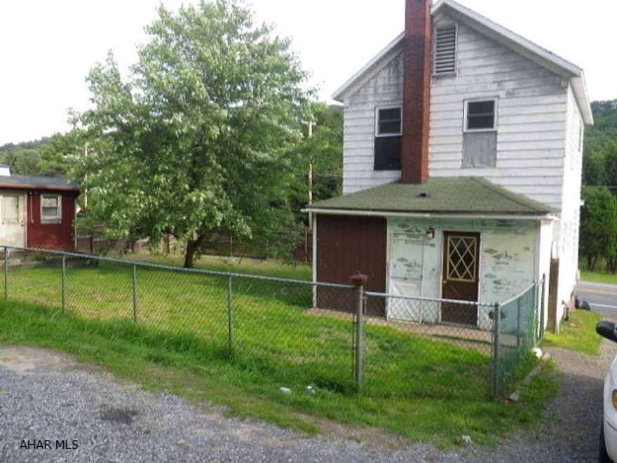 Nice 2 story house on fenced lot. Eat-in kitchen, 1 1/2 baths. Rec room, oil HW heat. Shed