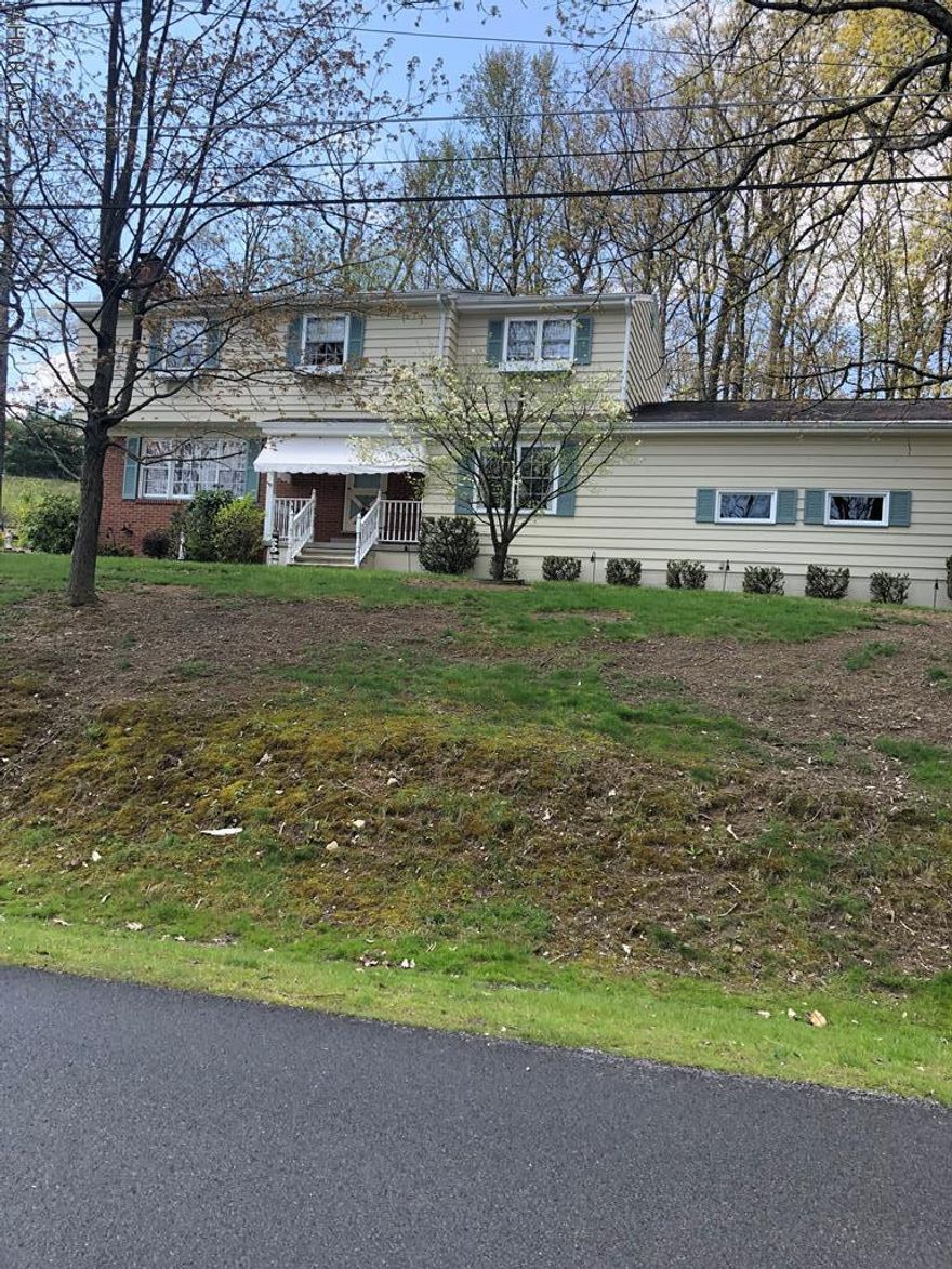 Move right into this 2 story Colonial. 4 BR, 2.5 BA, first fl FR. Eat in kitchen, all appliances included. LR w/wood FP, 2 zone hot water heat, MBR w/cedar walk in closet. Central Air, 2nd fl only some hardwood flooring. 2 tax ID numbers.