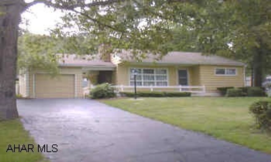 ATTRACTIVE RANCH IN COUNTRY SETTING. 2 LARGE BEDROOMS, BREEZEWAY AND ATTACHED GARAGE.