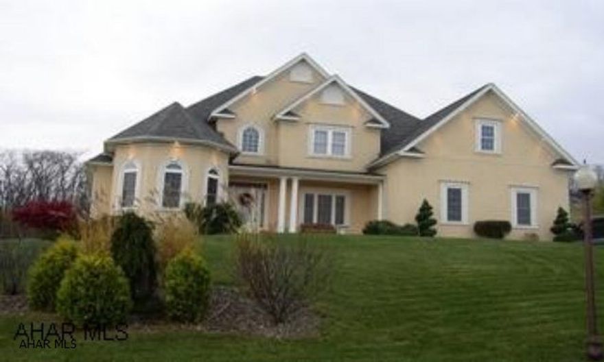 Luxuriously appointed home. Beautiful large first floor master with his and hers walk-in closets. Gourmet kitchen with vaulted ceiling opens to family living space. Lower level has home theater, recreation room and plumbed for bar.