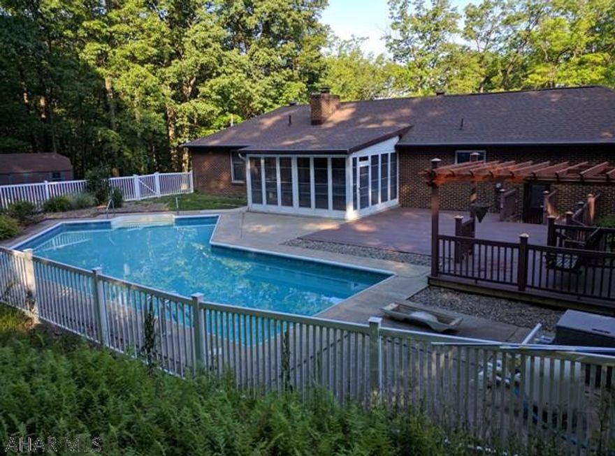 Large Brick Ranch with In-ground heated pool.  Beautiful Kitchen with newer Maple cabinets and adjacent laundry.  Finished basement with wet bar in large rec room, plus den/office and 4th BR and newer luxury 3/4 bath.  Central Air