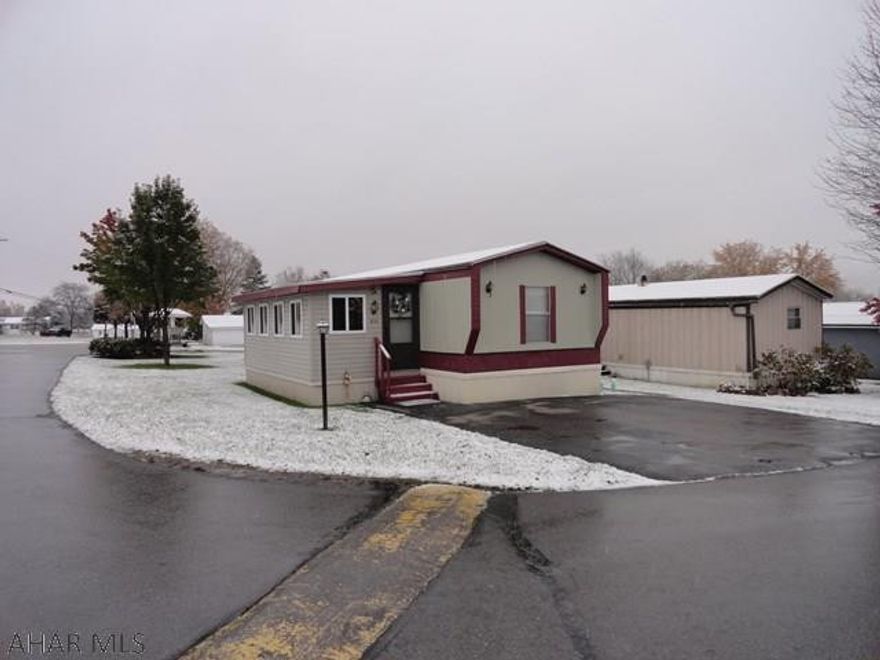 Spacious 2 bedroom, 2 bath with newer kitchen cabinets and counter tops, all appliances, hardwood floors throughout, finished Florida room for entertaining or extra living space, patio area and shed included. Well cared for and A MUST SEE!