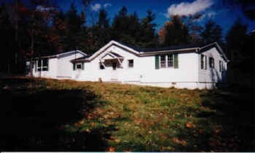 1 story with large family room, large 2 car garage, private 1 acre lot with stream and pond.  Electric not on.