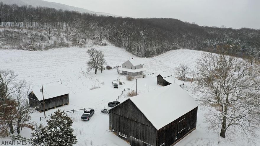 This picturesque farm is situated at the base of Warrior Ridge in beautiful Bedford County, PA. Resting on 115 acres, Clear Creek meanders through this open and wooded land as a peaceful reminder of nature's true elegance. App. 32 acres are tillable & the remainder is scenic wooded areas (timber value w/ cruise on file). The 2-story owner residence offers a living room, eat-in kitchen, two bedrooms & one full bath. Updated 100-amp electrical service, oil forced air heat, drilled well & a private septic system. 44' x 60' post & beam bank barn that has been well maintained w/ granary, tractor shed w/ loft, & a 2-story chicken coop. Situated very close to State Game Lands #97, an easy drive to the PA/MD state line, I-68 & I-70, Rocky Gap State Park & Resort, & Omni Bedford Springs Resort.