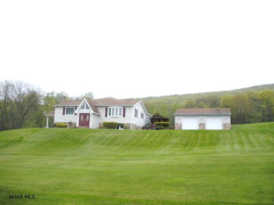 Beautiful country setting but close to everything, this meticulously maintained home sits on 1.3 acres and has a 2 car detached garage, large sunroom, 3 bedrooms, 3 full baths, newer oak kitchen with appliances, lower level family room with fireplace, lots of storage, brand new central AC system just installed, gazebo with hot tub, shed, and is nicely landscaped.