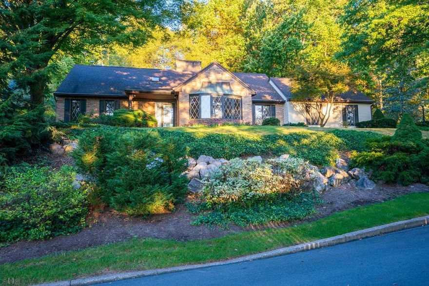 Location, location. Landscaped, on a Cul d Sac. Rich hardwood and tile floors. First floor Master suite w/walkin closet, sunken LR, formal DR, Office, family room w/gas fireplace, year round sun room, eat in kitchen, laundry & a powder room. 2nd floor - office & 2 large bedrooms w/closets & attic. LL recreation room with a working kitchenette, game area, storage, full bath w/jacuzzi tub, utility room & laundry. Back - patio & raised gardens w/garden shed. 2 car garage, cement drive and walks.