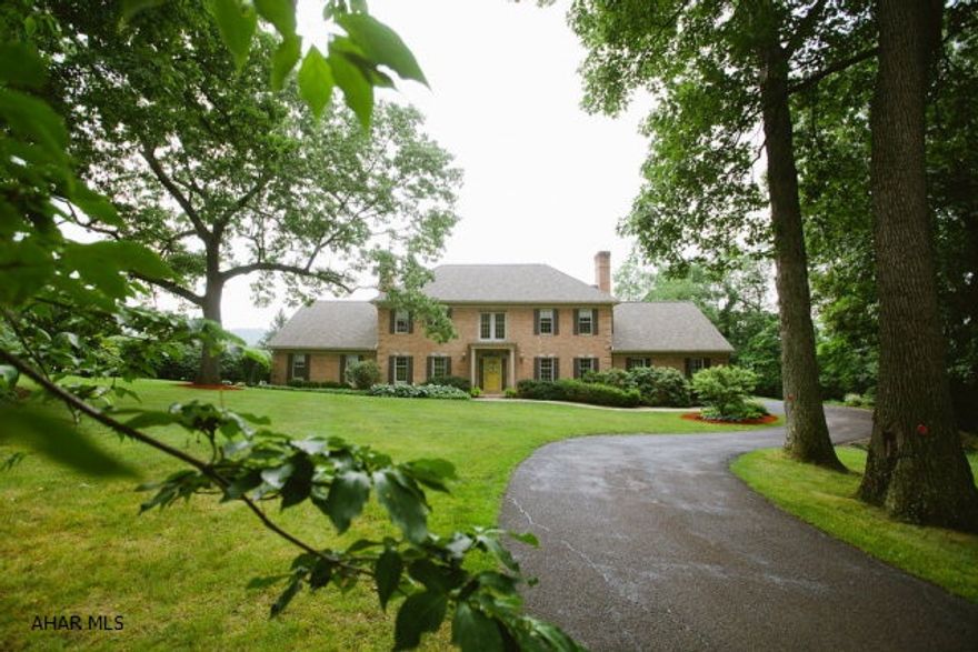 Stunning, custom, brick Home on one of the most sought after streets in Blair County...Adjacent to Blairmont Golf Course, restaurant and swimming pool. Located at the end of a quiet cul-de-sac, this home combines elegance and comfort. Picture yourself enjoying  evenings in the 2 story great room...featuring a stone woodburning fireplace...floor to ceiling windows allow you to take advantage of the gorgeous views.  New kitchen boasts bird's eye maple and natural cherry cabinets, state of the art Miele appliances and a huge center island....again a great view from the large windows.  Entertain on the patio and enjoy the in-ground pool.  First floor owner's suite with a huge bath...double sink areas, jacuzzi tub and his and hers walk-in closets. A 1 Year Home Protection Plan will be provided.