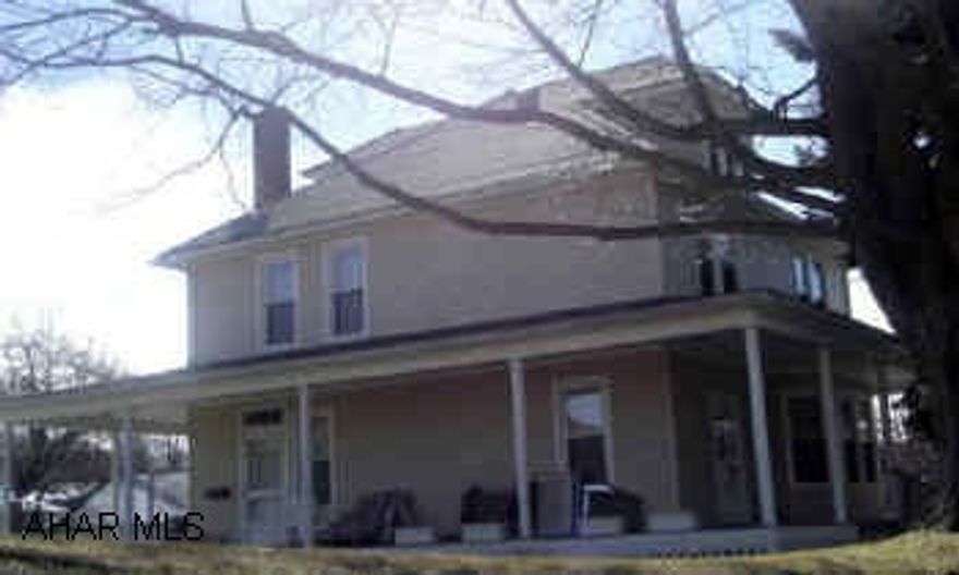 2 story home with large rooms, new windows and vinyl siding.  Also has wrap around porch and two car detatched garage all on 3/4 acre.