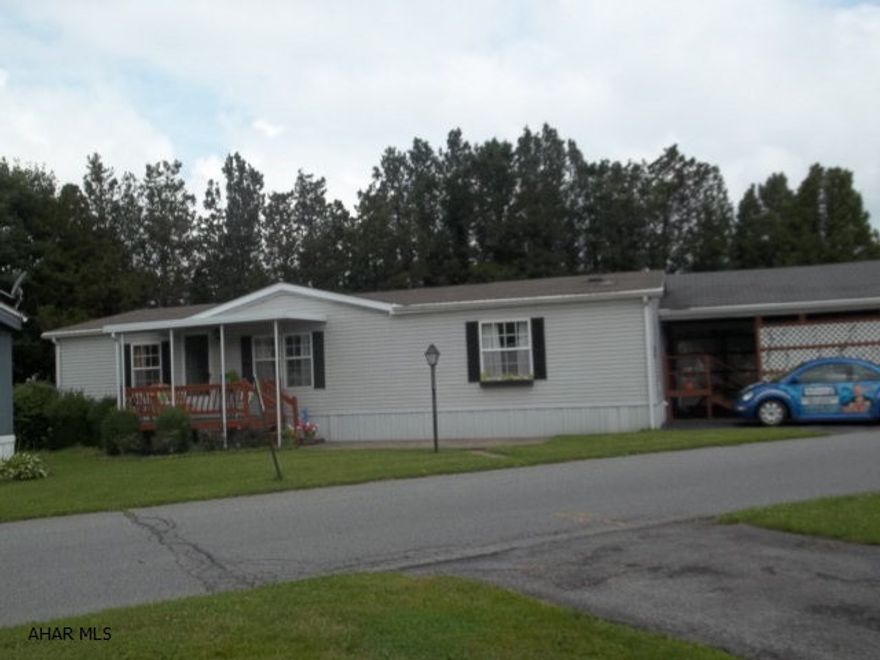 Absolutely beautiful move-in-ready double wide with open floor plan, new carpet, fresh paint,new gas furnace with heat pump and CA and two car carport.  55+ community in ElDorado