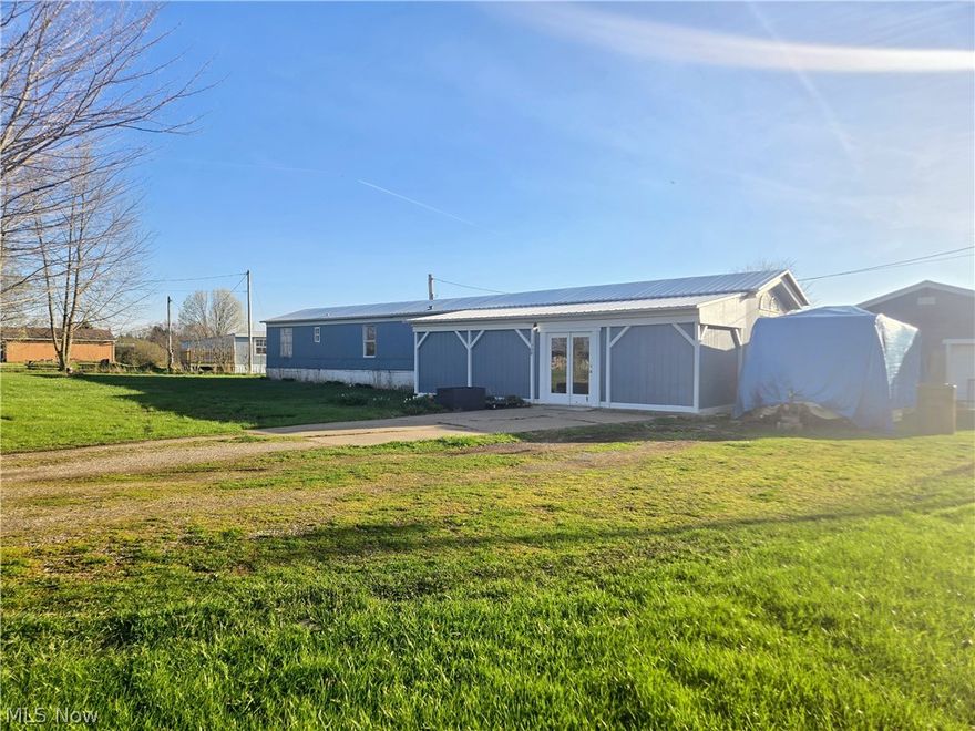 Come see this affordable country living dream! If you've been searching for a little acreage without breaking the bank, this property is a must-see!

Inside, this home offers 3 beds, 1 and ½ bathrooms as well as an extra room that can be used for an office, library, or an additional living room space. In the front, there is a 30x10 enclosed area, perfect for storage, a mudroom, or flexible use. Outside, you'll find a spacious 24x24 garage for vehicles, tools, or hobbies. You will also find a chicken coop and a shipping container for additional storage. Key updates include, a new roof in 2021, hot water tank in 2025, and new fridge and stove in 2025. Make it your own! Come enjoy 2 acres in the countryside of Wayne County!