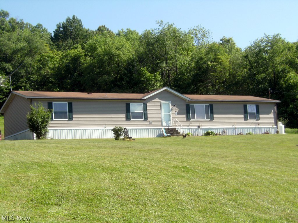 5 acres on Raven's Road near Salesville is home to this 5 bedroom 2 bath newer manufactured home. With over 2100 square feet of living space this home features a well equipped kitchen with lots of cabinets and counter space. The kitchen appliances will stay and the dishwasher is 2 years old. The kitchen includes a convenient pantry and the laundry/mud room is just a few step away. The dining room is adjacent to the kitchen and opens to large living room with vaulted ceilings. The private master suite has a walk in closet, the master bath features a soaking tub with a separate shower. The four additional bedrooms are located at the opposite end of the home and share the second full bath. If you are looking for a county setting just a short drive from both Seneca Lake and Salt Fork State Park this property might just be what you have been looking for. Mineral right to not transfer at this price.