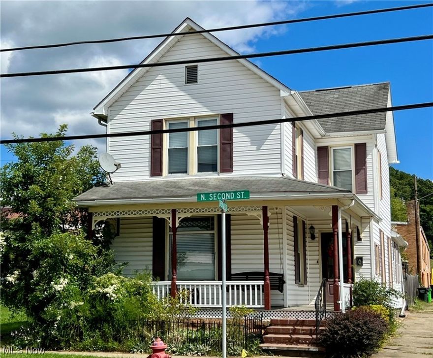 Spacious home with lots of character through-out! 3 bedrooms 1.5 baths showing beautiful woodwork, pocket doors, tin ceilings and 4 fireplaces. Unique entry way leads into a large living room and dining room with each having its own fireplace. (Decorative use with the possibility of being operational) Kitchen with appliances. First floor laundry with stackable washer and dryer, and first floor half bath. 3 nice size bedrooms on the 2nd floor with 2 of them having a fireplace.
Large front porch or fenced in patio to enjoy. Custom built shed with electric and wood burner for whatever purpose you choose. Corner 25x125 lot close to school, hospital and downtown area. Lots of potential here! Take a look. This home is selling as-is. Back on the market due to no fault of the Seller.