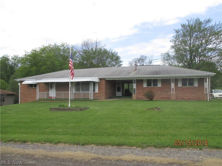 This serene setting welcomes everyone to beautiful country living. It features all freshly painted walls, new laminate floors, decorative plaster ceilings and spacious living room.  Country kitchen with plenty of cabinets, work area, snack bar, new convection oven, new hood (to be installed) and sliding doors leading to back porch.  Basement has finished room and storage closets.  Breezeway leads to attached garage, 2 car detached garage with storage.  All this and trees in backyard for shade.  Must see !!!!!!!!!!!!