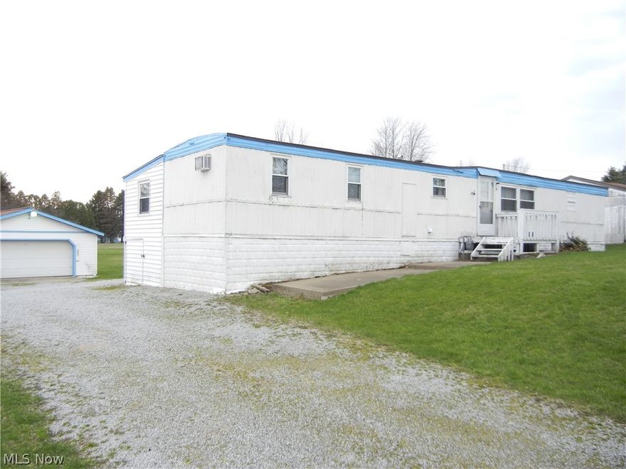 Wheelchair compatible 3 bedroom home on 0.6 acre lot with updated kitchen and tilt-in windows. Good clean condition, ready to move in. 24x32 detached garage with 10x32 attached carport. Garage has concrete floor, drain, and 220 electric. Very affordable, no zoning.